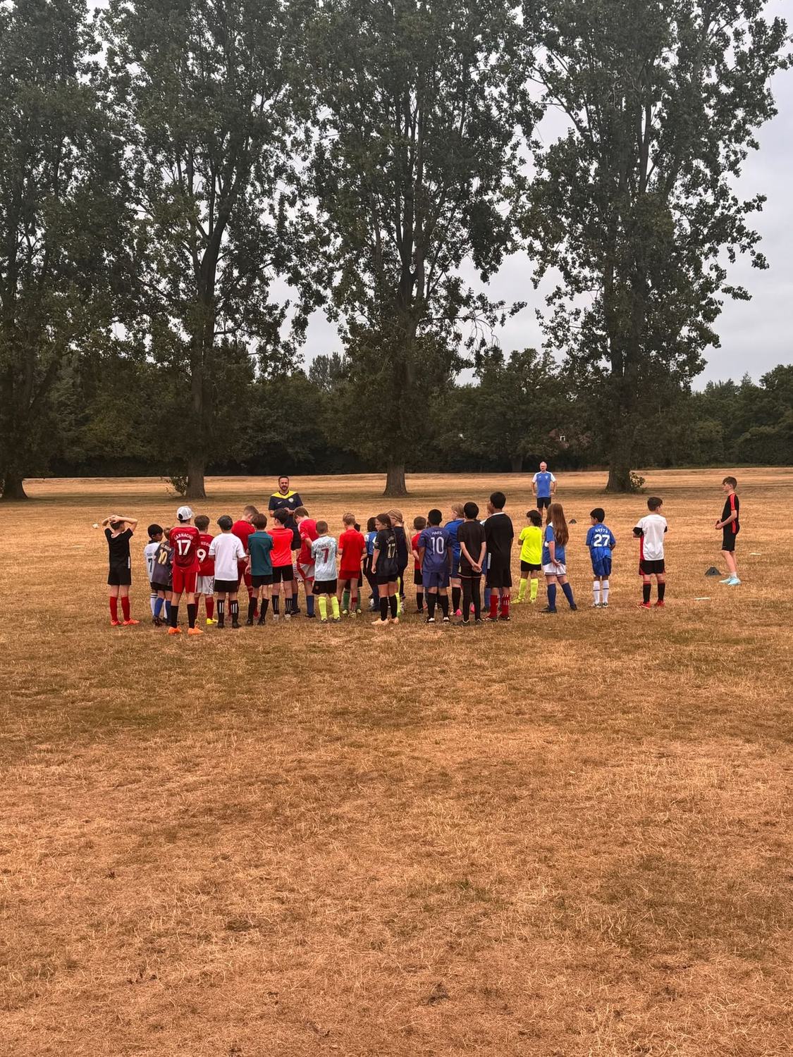Team talk at an Excel Coaching football camp
